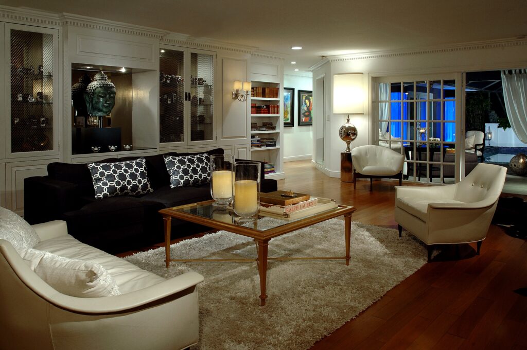 Layered residential living room with custom cabinetry and gilt cocktail table