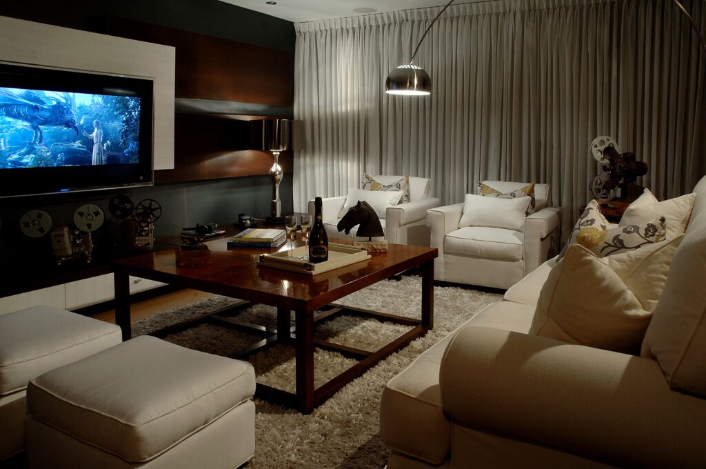 Intimate den lounge with bronze Buddha and patterned pillows